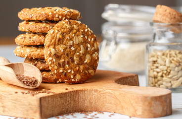Freshly baked homemade vegan oatmeal cookies with cereals - flax seed, sesame and sunflower. Useful snack. Traditional breakfast. The concept of healthy eating. Selective Focus - 407478091