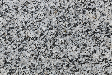 Natural grey  granite with black spots.