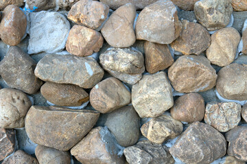 The stone wall constructed by gray wall