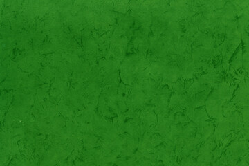 Cardboard green abstract pattern texture close-up. Retro old paper background. Grunge concrete wall. Vintage blank wallpaper.