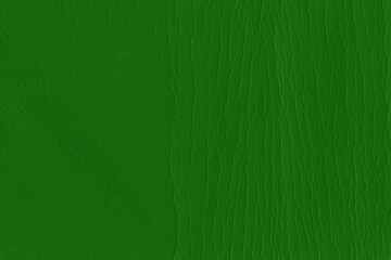 Cardboard green abstract pattern texture close-up. Retro old paper background. Grunge concrete wall. Vintage blank wallpaper.