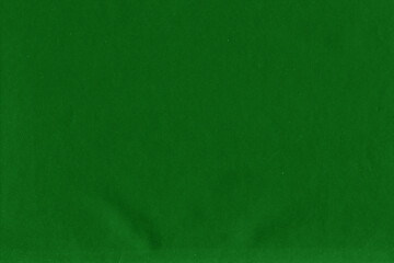 Cardboard green abstract pattern texture close-up. Retro old paper background. Grunge concrete wall. Vintage blank wallpaper.