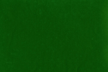 Cardboard green abstract pattern texture close-up. Retro old paper background. Grunge concrete wall. Vintage blank wallpaper.