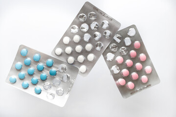 Colorful antibacterial pills on a white background. Pharmaceuticals antibiotics medicinal tablets