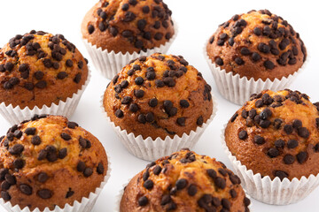 Just baked chocolate muffins isolated on white background