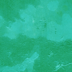 Cardboard green abstract pattern texture close-up. Retro old paper background. Grunge concrete wall. Vintage blank wallpaper.