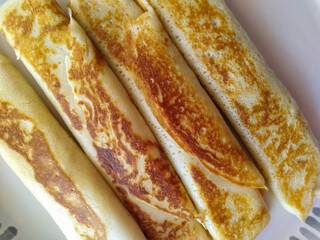 pancakes baked golden brown rolled and stuffed