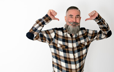 Man with big beard and mustache, plaid shirt raising arms and pointing to himself with funny face...