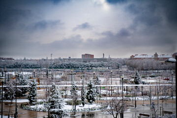 Bullring in the municipality of Getafe after a heavy snowfall, and roof of the Magdalena Cathedral