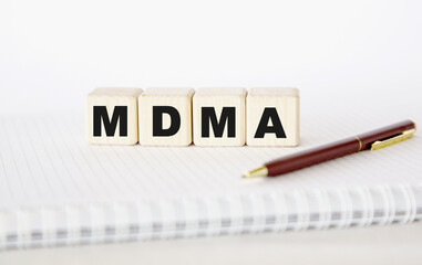 MDMA. written word. cubes, notepad and pen.. You can use in business, marketing and other concepts. Messege of the day.