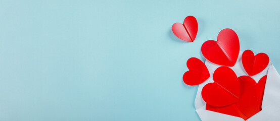 Envolope and Red paper hearts. Valentine's Day Concept. Flat lay, copy space. Banner for design