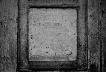 The frame is made of a concrete wall. The texture of an old concrete surface. Grunge style background with empty space