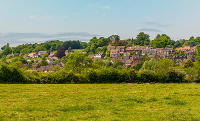 Fototapeta na wymiar A view across the fields towards the village of Napton, Warwickshire in summertime