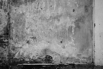 The frame is made of a concrete wall. The texture of an old concrete surface. Grunge style background with empty space