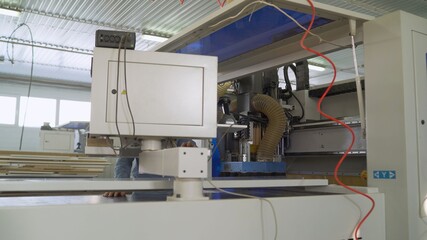 CNC woodworking wood processing machine, modern technology in the industry. CNC wood cutting machine. CNC machine for wood.