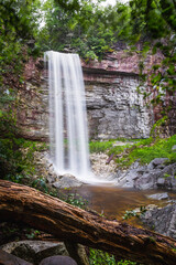 Long exposure of waterfall in summer woods
