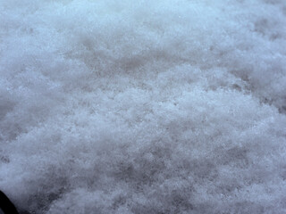 snow, on the surface of a rusty barrel