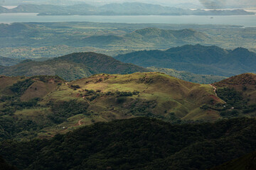 Landscape view of rolling green hills with spotlight of sunshine