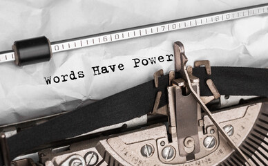 Text Words Have Power typed on retro typewriter
