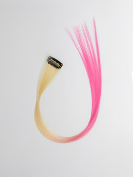 Colored strand of hair with a barrette