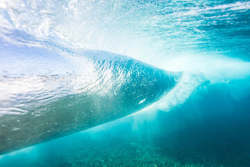 Underwater view behind breaking wave