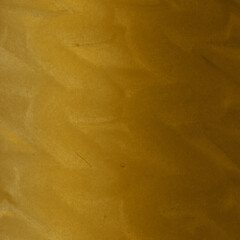 Gold ink and watercolor texture on white paper background. Gradient paint strokes and decalcomania effect. Hand-painted gouache abstract image. Mess on the canvas.