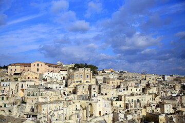 Fototapeta na wymiar Blue sky on the stratifications of the houses of the Sassi of Matera, European Capital of Culture 2019