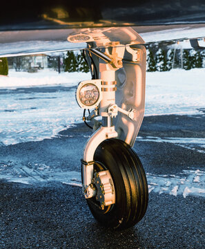 Close-up view of the retractable wheel of a small sports aircraft.