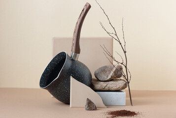 Abstract minimalist balance composition or still life with coffee pan and ground coffee and nature meterials: stone, marble, clay, plant branch, copy space for design, modern art coffee concept