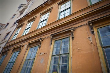 Fototapeta na wymiar Old vintage brown colour building with windows in bottom view in Budapest downtown, Hungary 