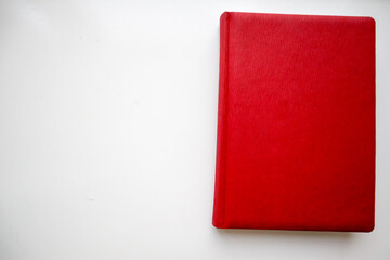 book with red cover on white background