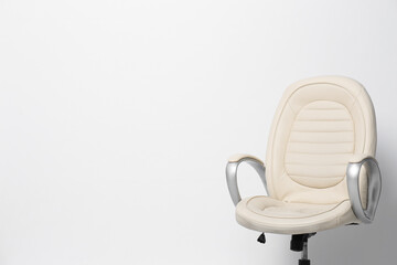 Comfortable office chair on white background, space for text