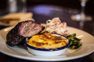 Juicy brisket dish with pie and salad 