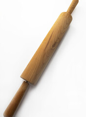 A large rolling pin made of wood lies on a white background