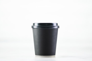 Paper cup of coffee on white background