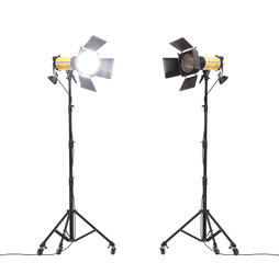 Flash lights with barn doors on stand with wheels. Studio lighting equipment isolated on white...
