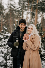 couple in winter forest
