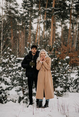 couple in winter forest
