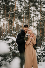 couple in winter forest
