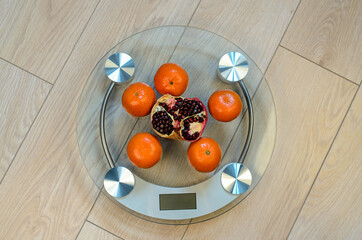 Bathroom scales and fruits. Fitness for weight loss.