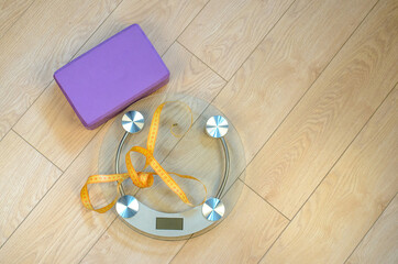 Bathroom scales and centimeter and yoga bricks. Fitness for weight loss.