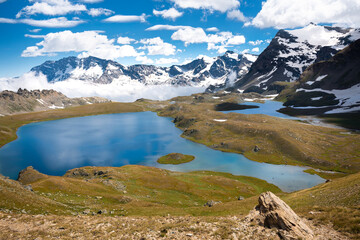 Alpine lakes, fields, and mountains in the Gran Paradiso National Park
