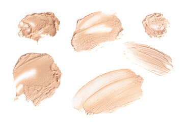 Fototapeta premium Set of brush strokes for makeup in different colour isolated on white background. Foundation face make-up samples, texture of face concealer. Make up smears, cosmetic, foundation colors palette