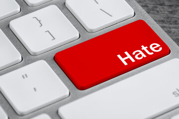 Fototapeta premium Red button with text Hate on computer keyboard, closeup