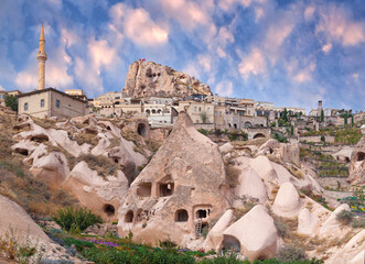 Panorama of Uchhisar and unique geological formations in Pigeon valley at sunset in Cappadocia, Central Anatolia, Turkey © Zzvet