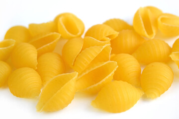 Raw pasta on a white background.