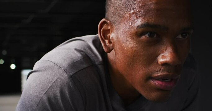 Portrait of african american man taking a break and breathing heavily