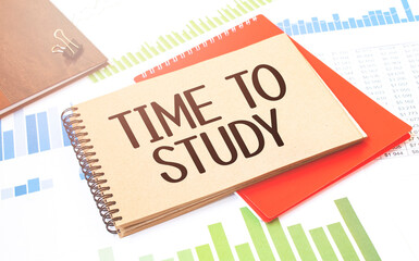 Notepad with text time to study. Diagram, red notepad and white background