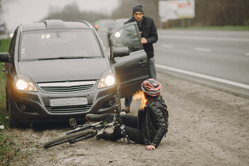 The woman crashed into the car. Girl in a helmet.