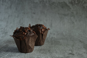 chocolate muffins on a dark background